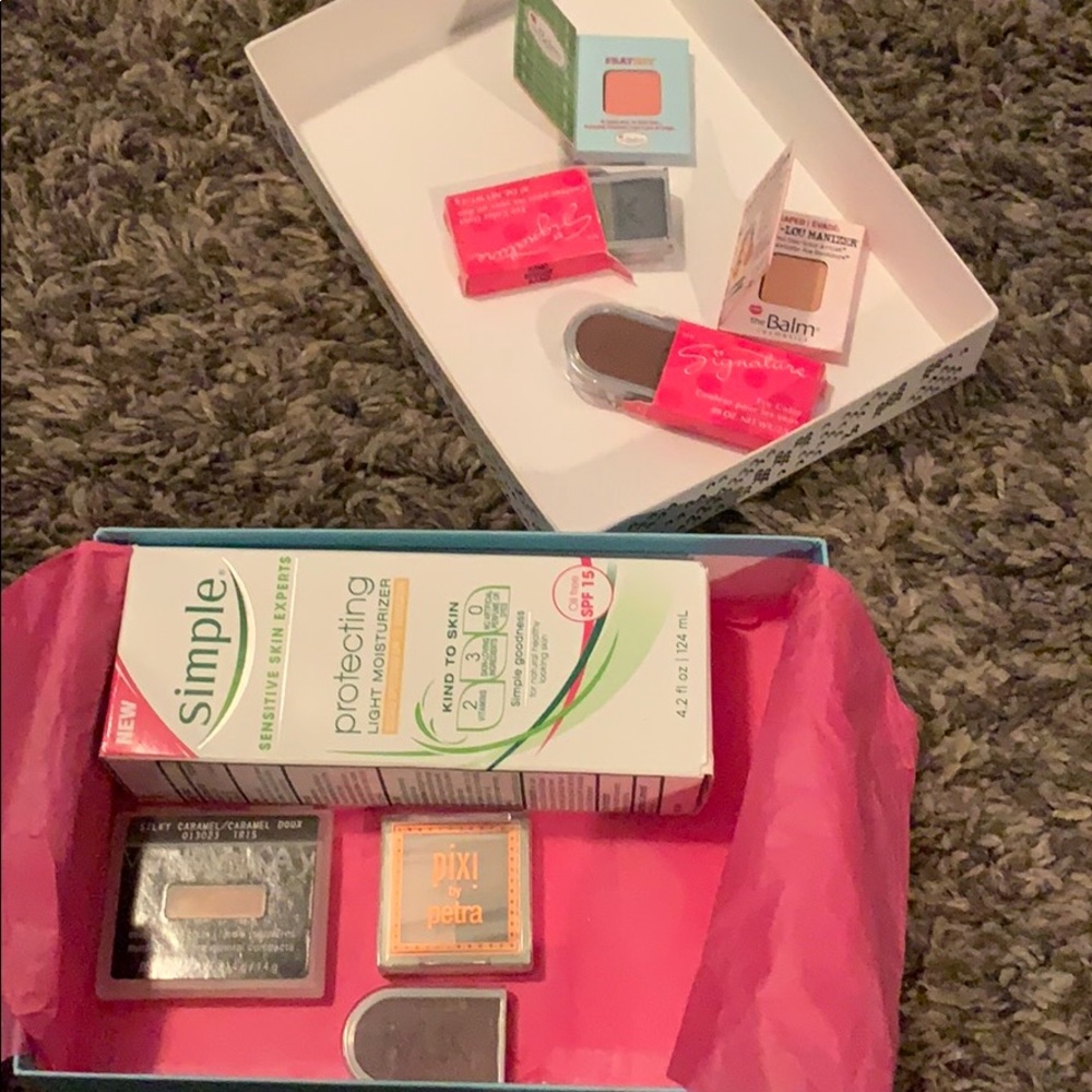 Box of eye shadows and skin lotion